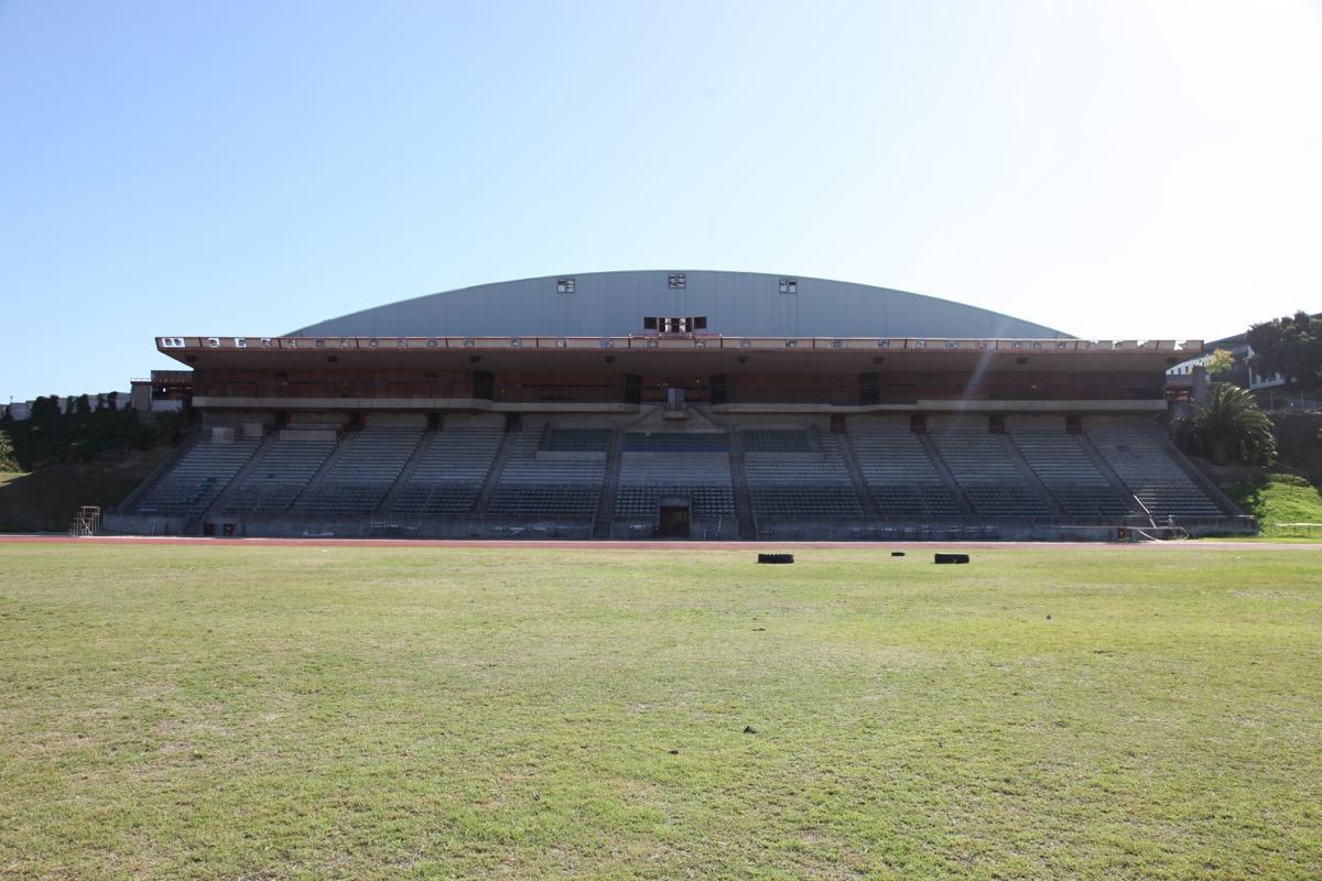 Curved exterior of the Bellville Velodrome dome across an empty field