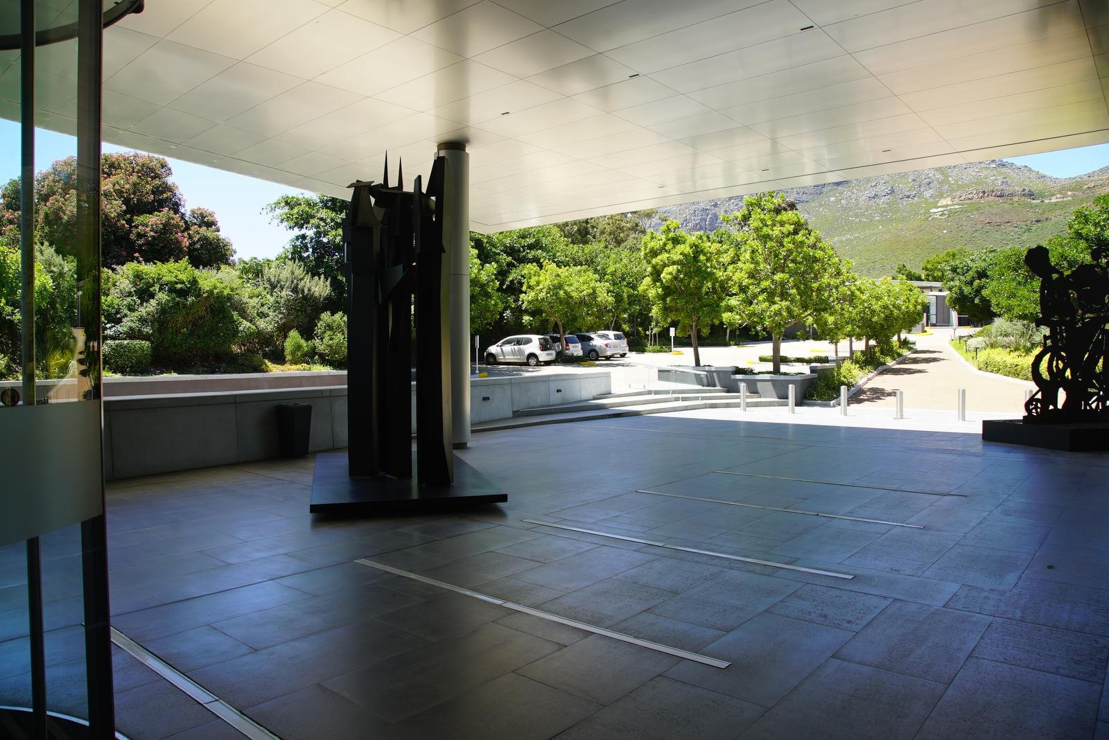 Sculpture garden seen from under the Norval Foundation entrance canopy, mountain slope behind