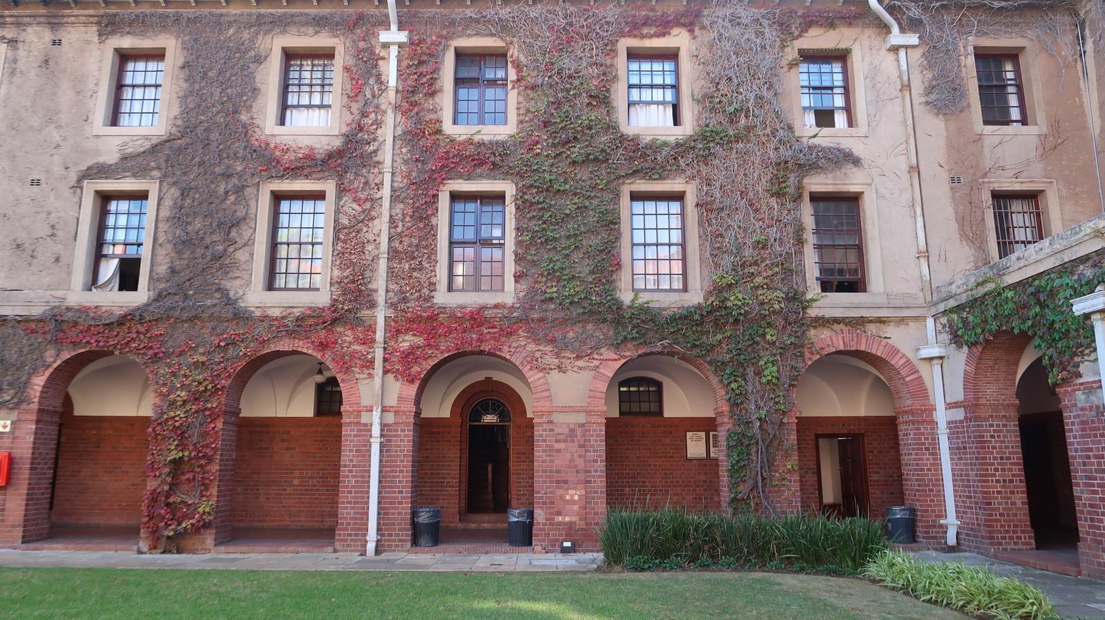 Ivy-covered residence buildings around a court on the upper campus