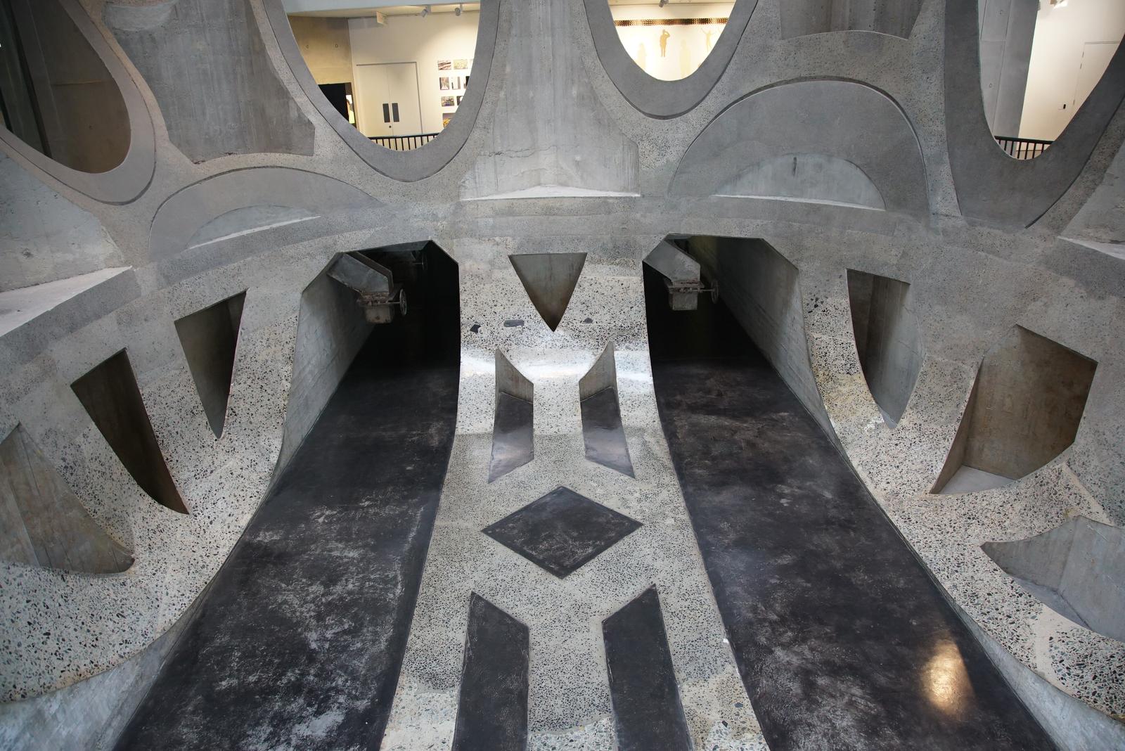Carved concrete atrium of Zeitz MOCAA seen from above, cut silo cylinders forming vaulted openings